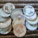 13 mismatched flat plates in ironstone