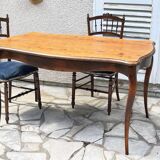 Solid wood table with curved legs