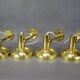 Set of four adjustable brass wall lights, Germany, 1960s.