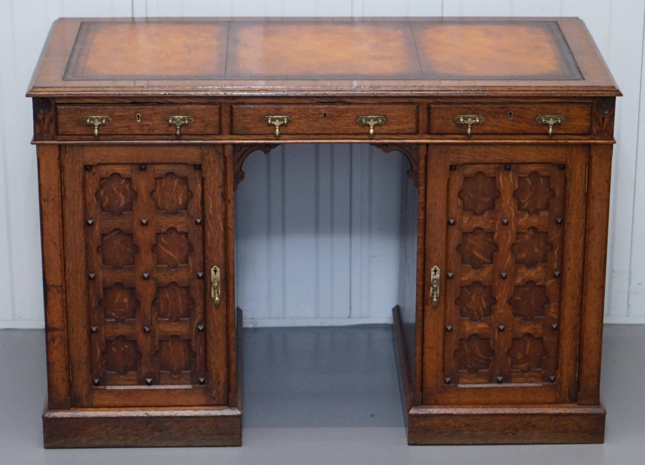 Restored Gothic desk with side bookshelves, drawer, and sloping top by Pugin Gillows.