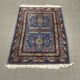 Small handmade wool Iranian rug.