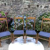 4 vintage Roche Bobois chairs from the 80s in beech with woven seats in blue fabric.