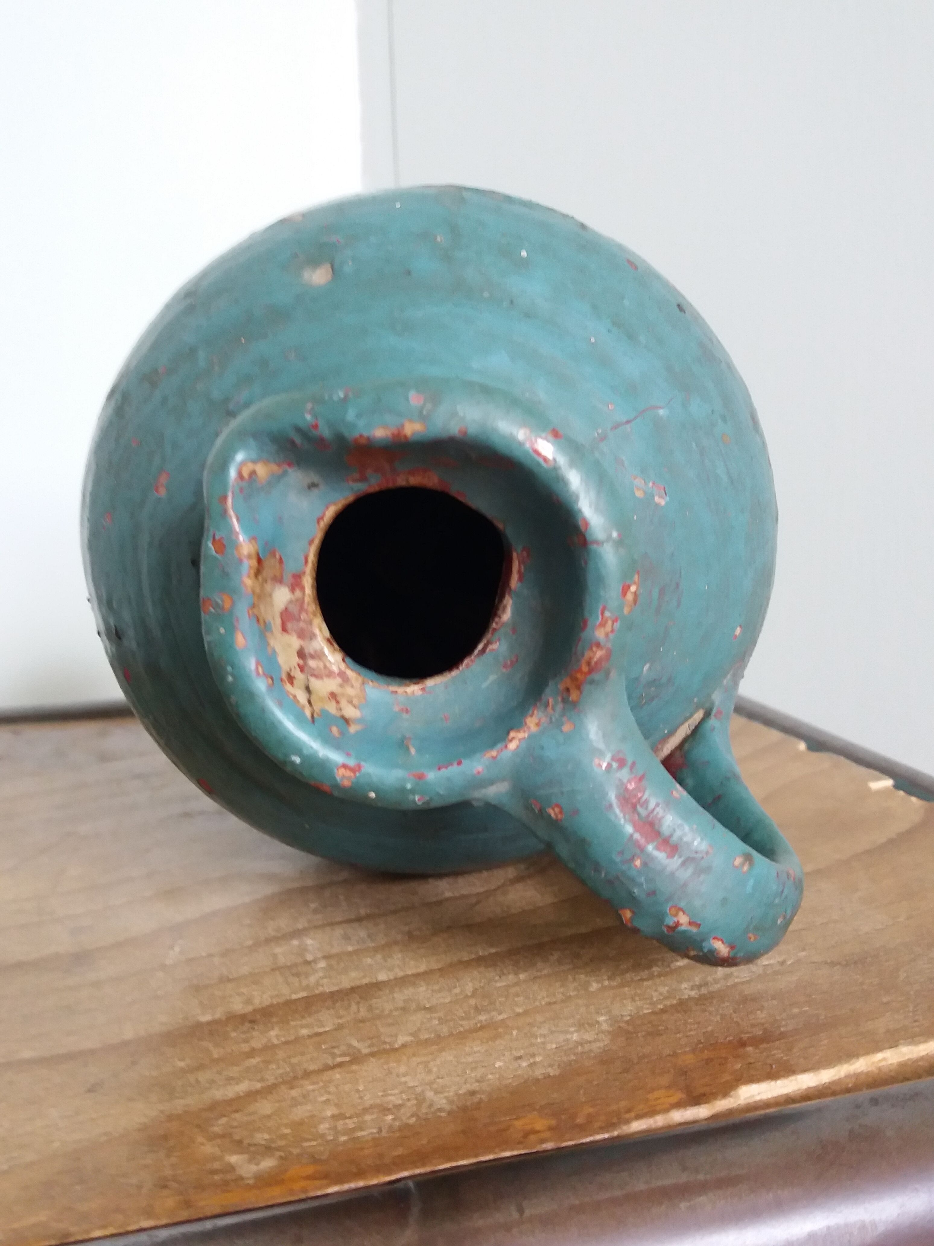 Sandstone pitcher painted in turquoise, very old pottery
