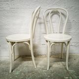 Pair of white Baumann bistro chairs