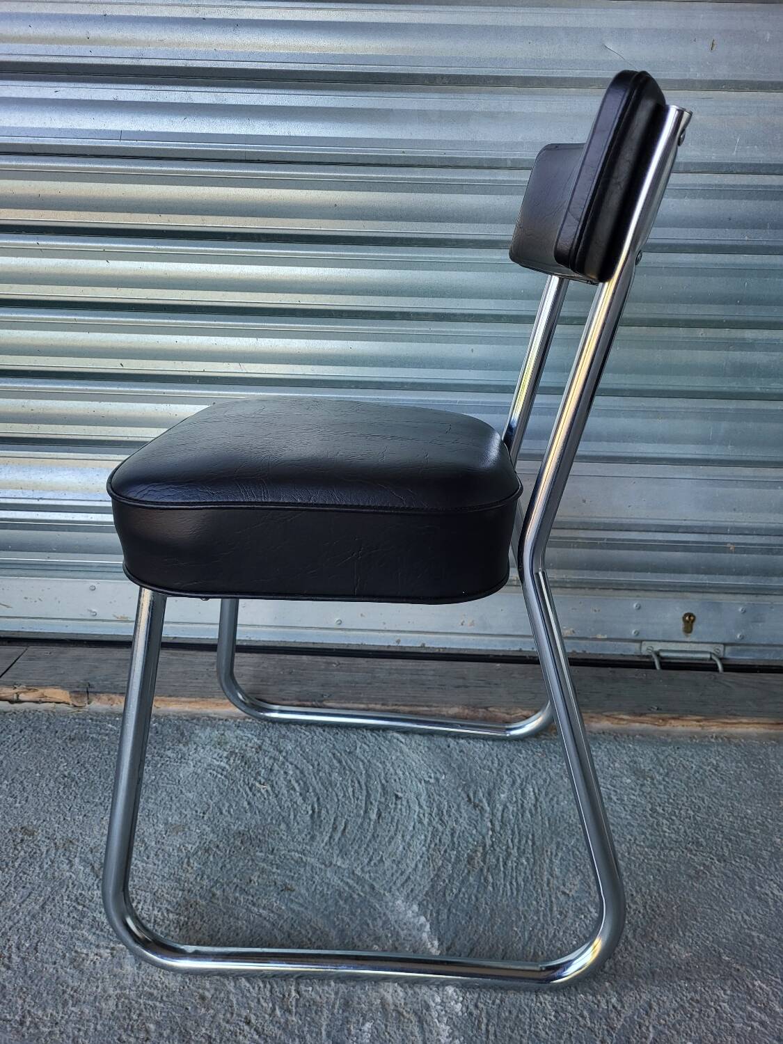 Pair of vintage black and chrome leatherette office chairs in very good condition