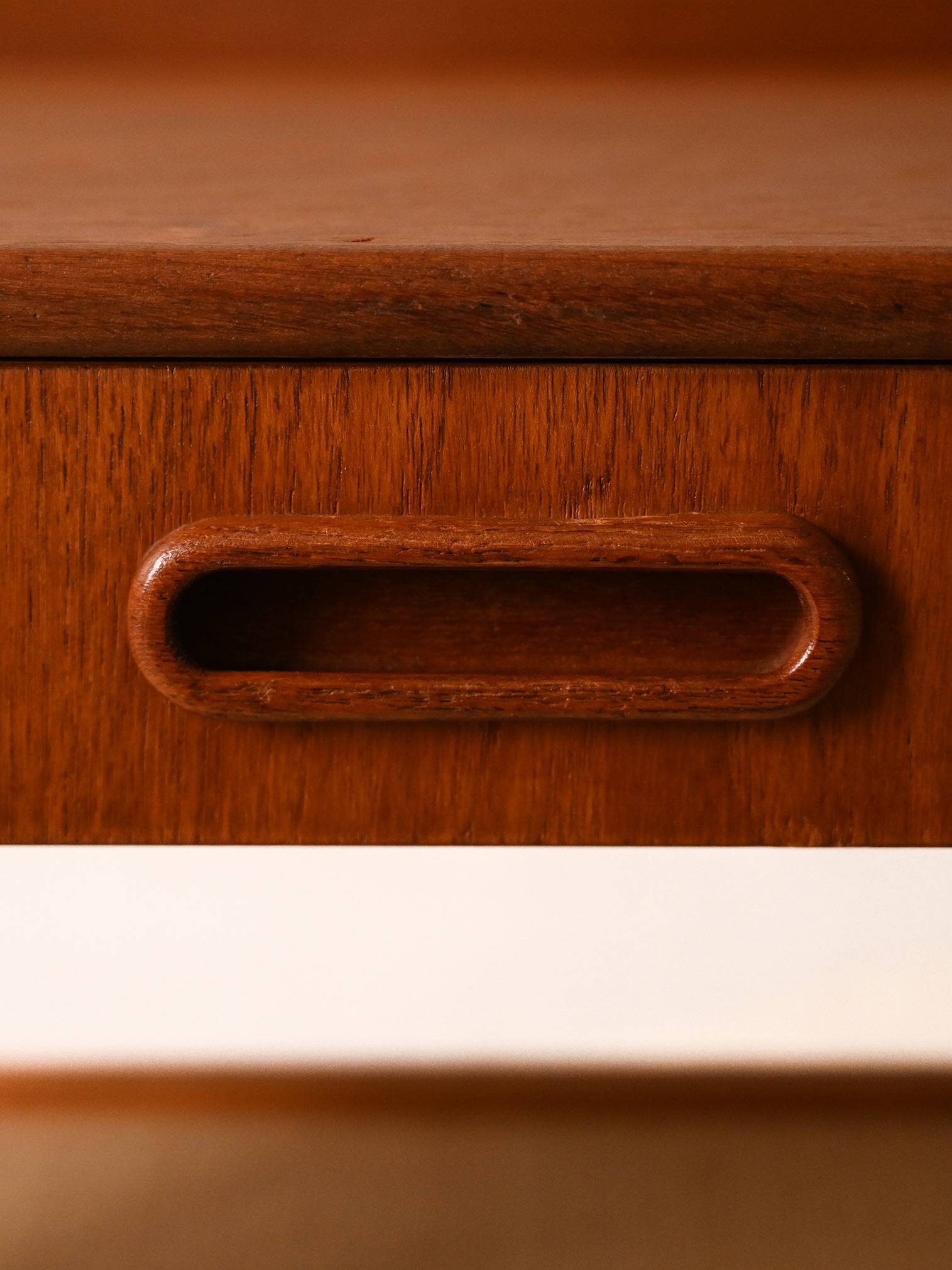 Bedside table with rattan magazine rack