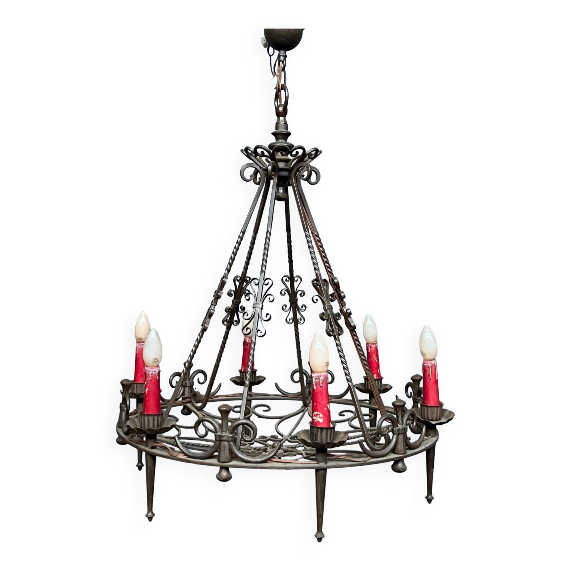 Wrought chandelier in Gothic style.