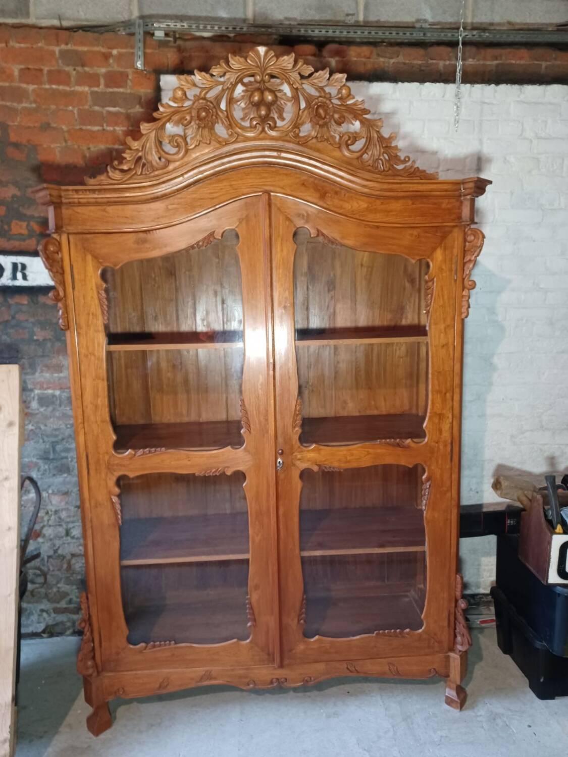 Large glass and carved cabinet