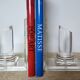 Pair of column bookends in plexiglass and gold metal, 1980s design.