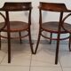 Pair of curved wooden armchairs