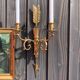 Pair of wall lamps decorated with bronze arrows "Cupid"
