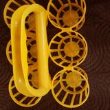 Vintage yellow plastic bottle holder