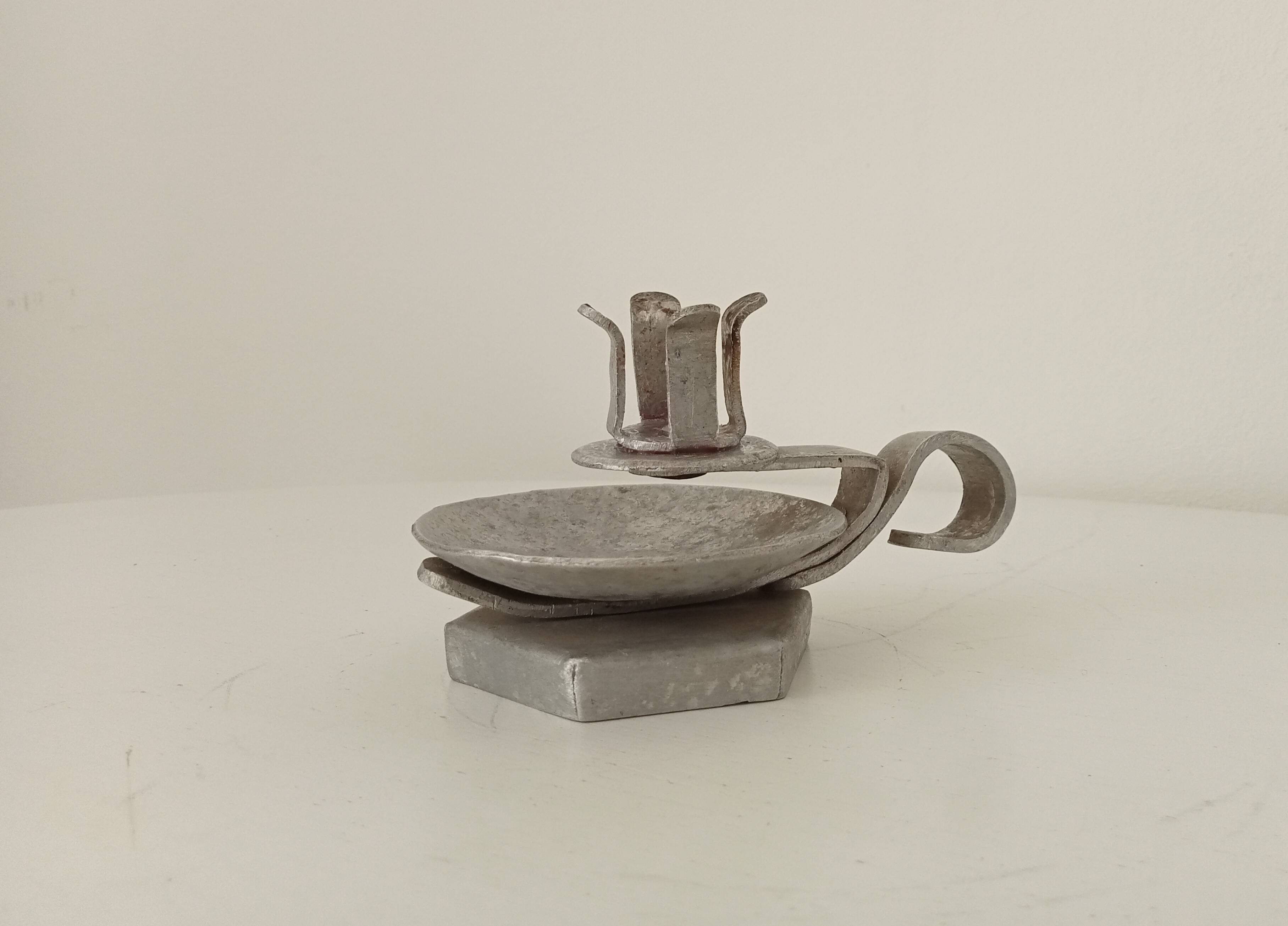 Vintage zinc hand candle holder