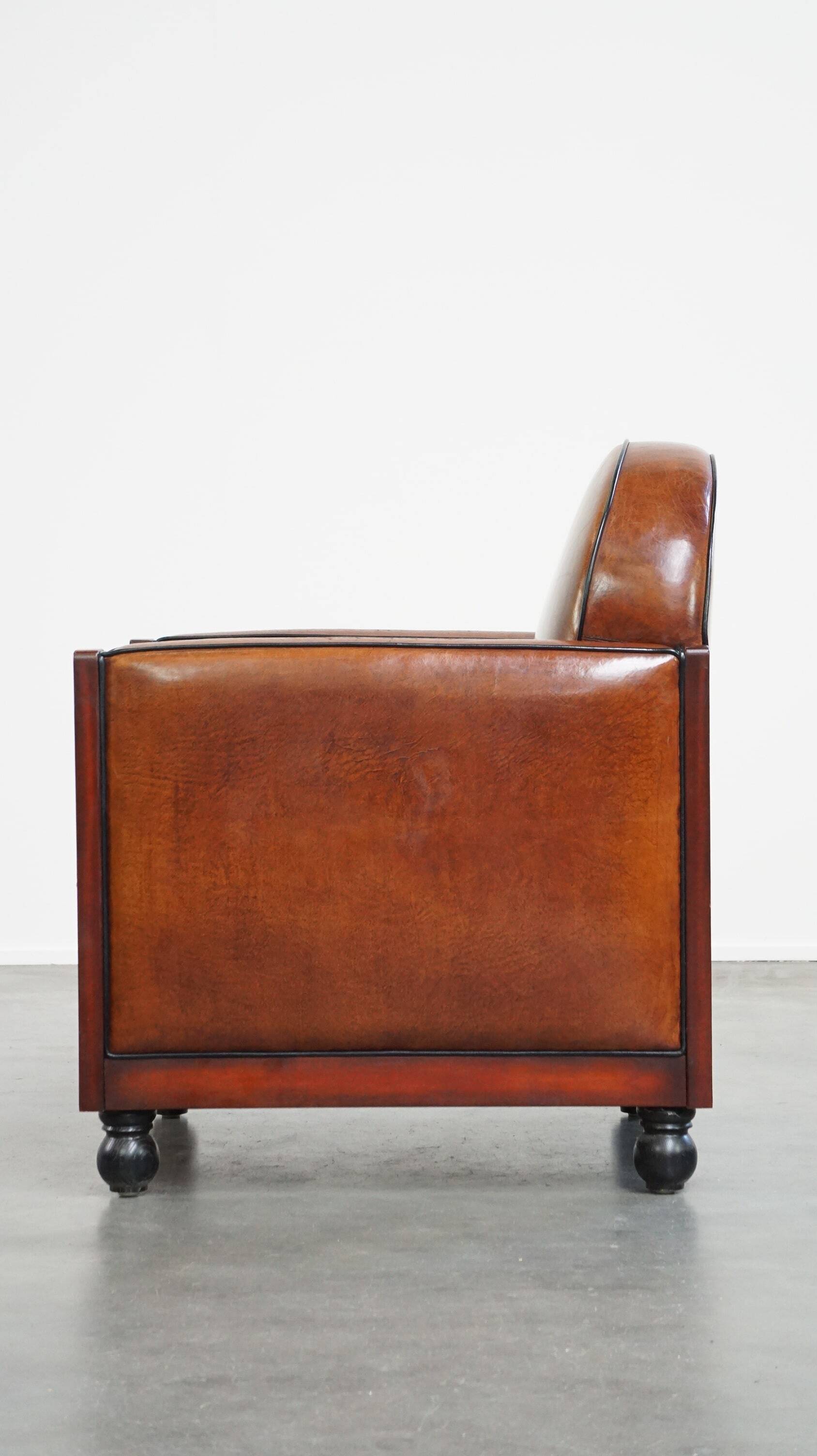 Cognac-colored sheepskin Art Deco design armchair in good condition