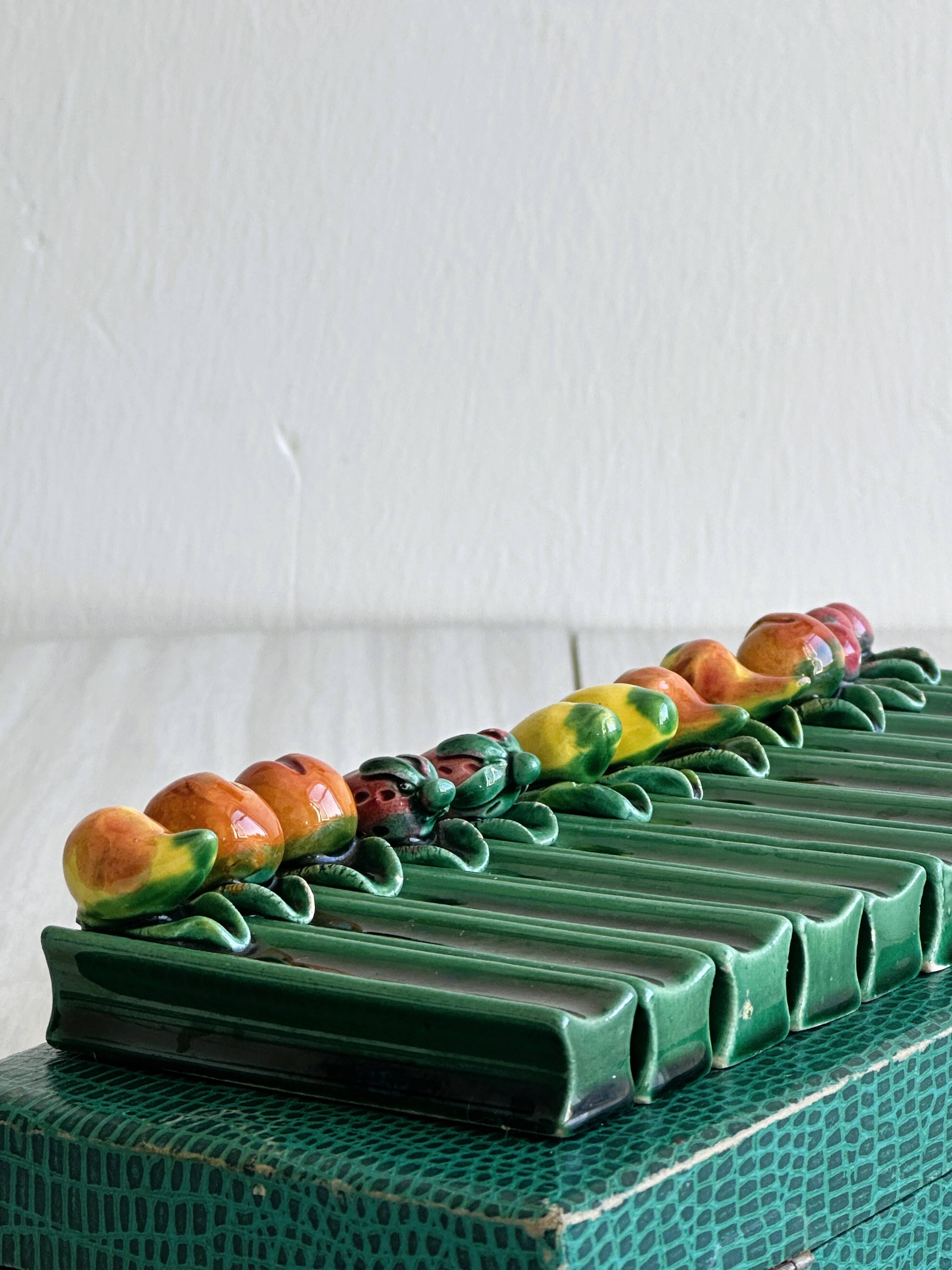 12 ceramic fruit knife holders.