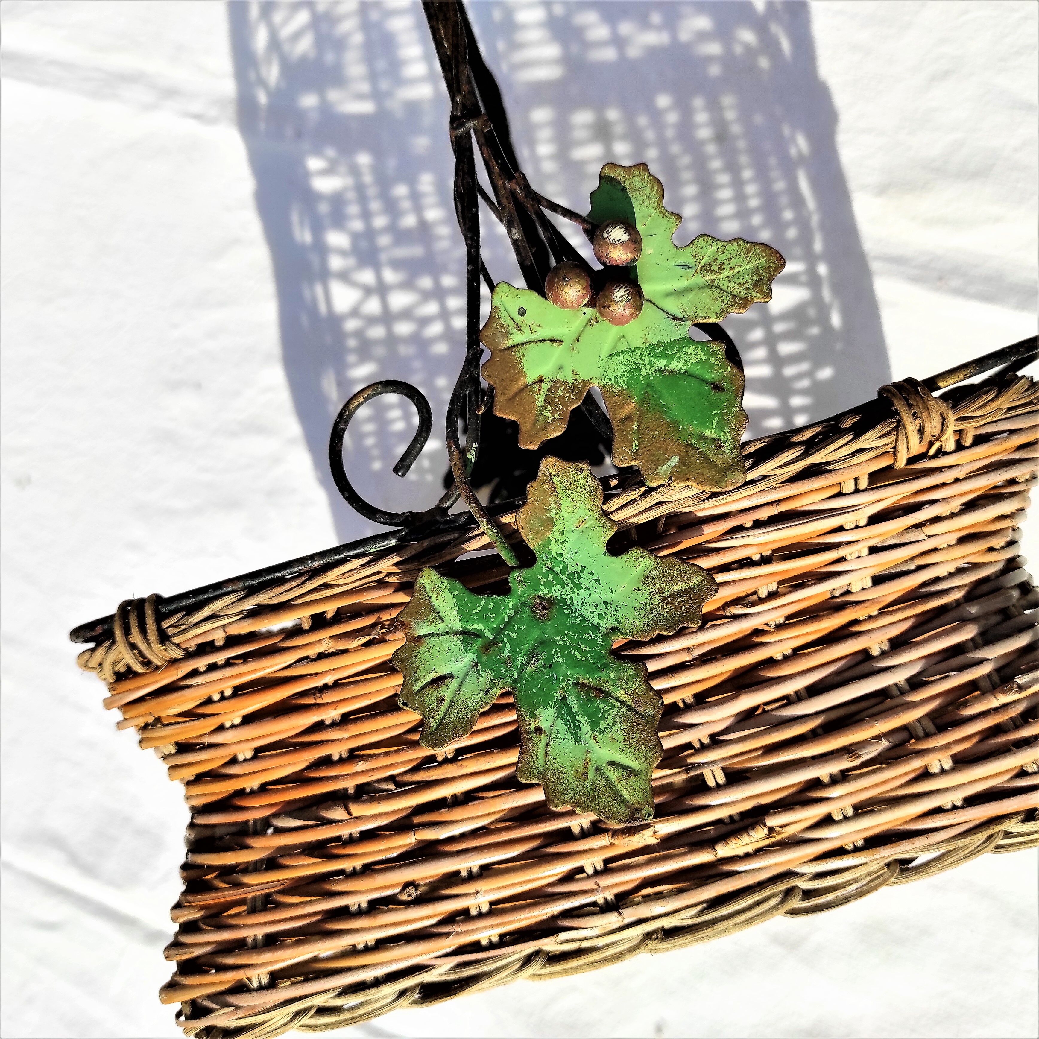 Old wicker basket decoration vine leaves and grapes