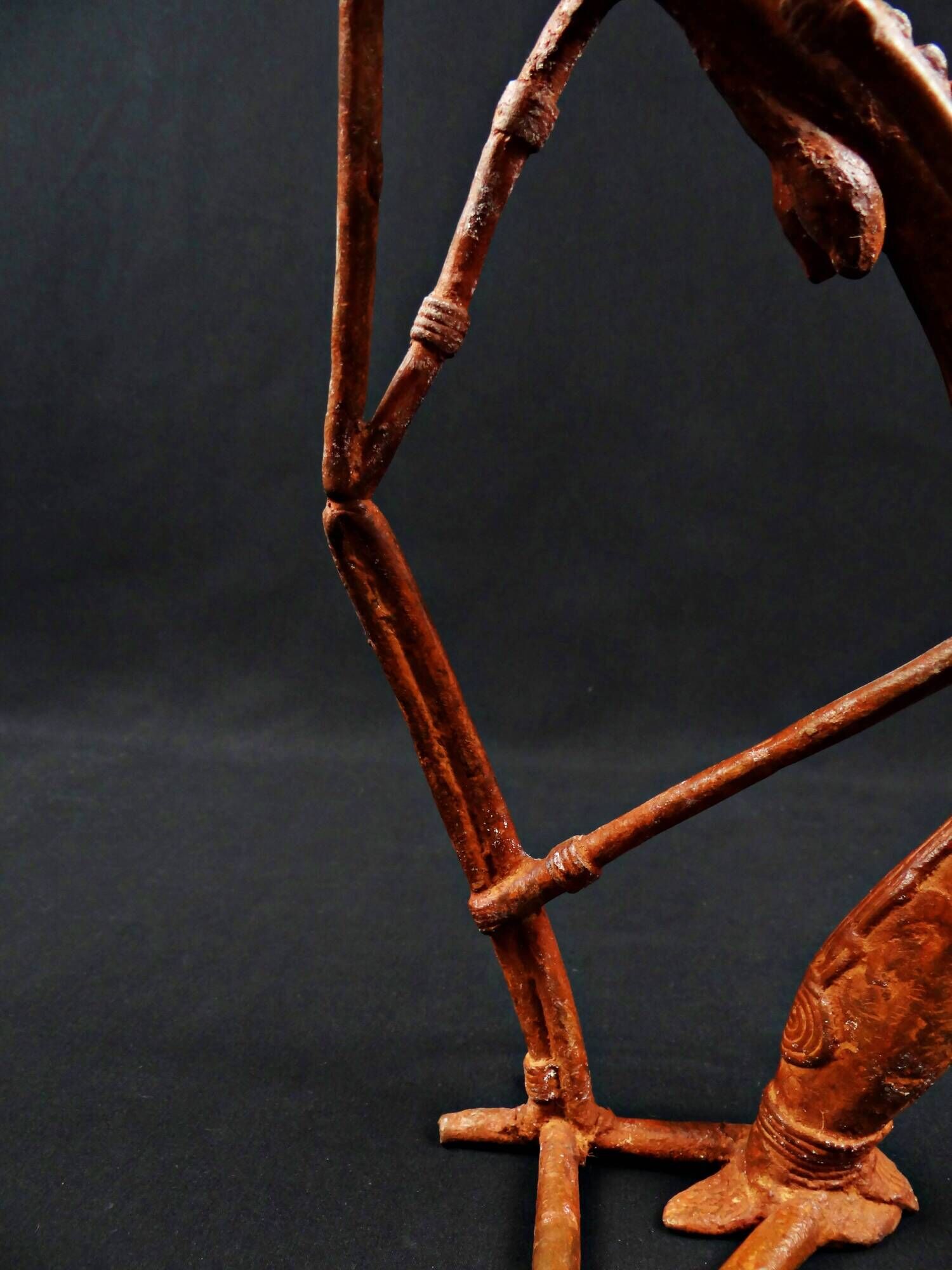 Dogon Nommo bronze statue with brown patina and red highlights, mid-20th century