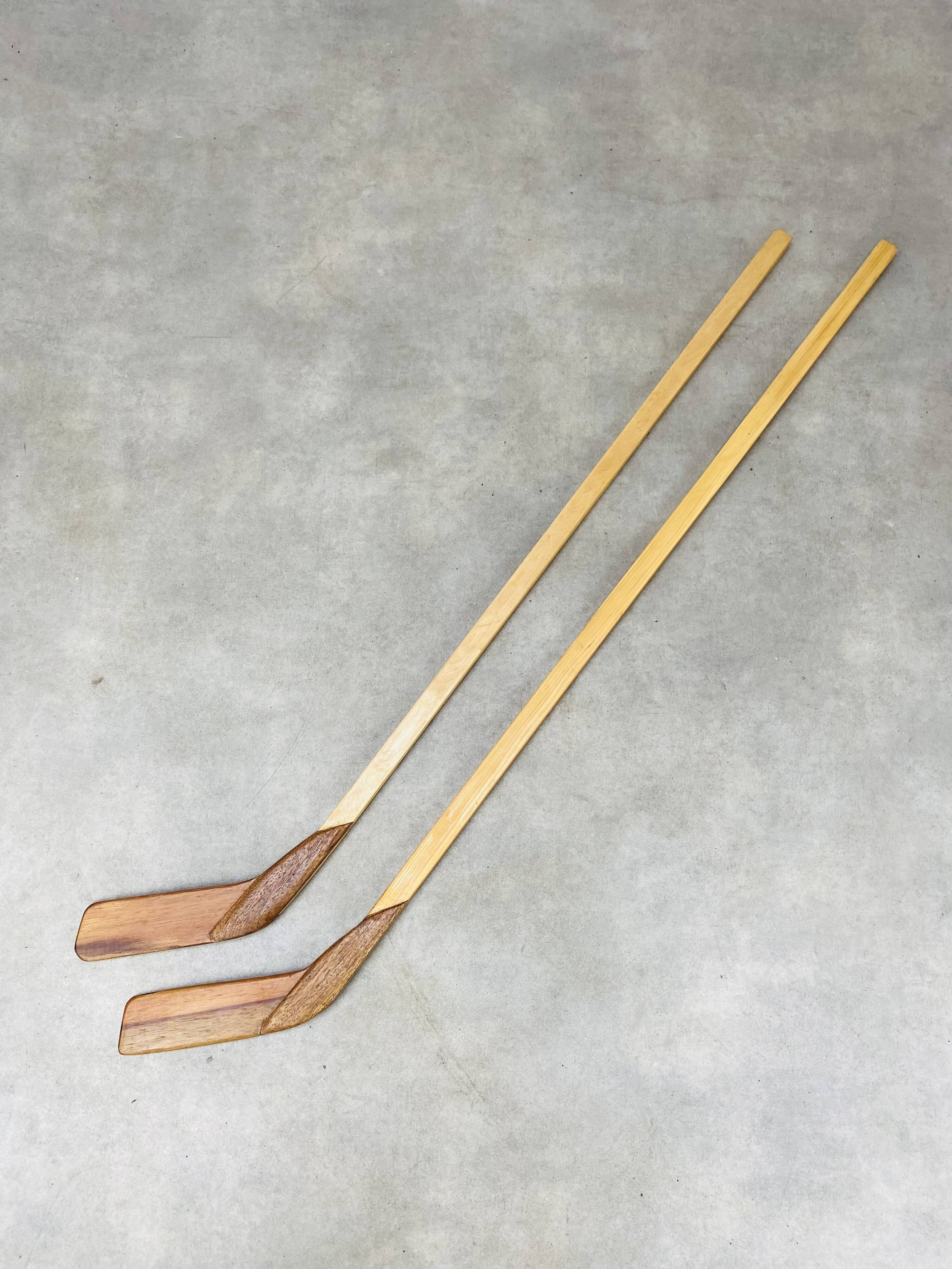 Pair of vintage wood hockey sticks