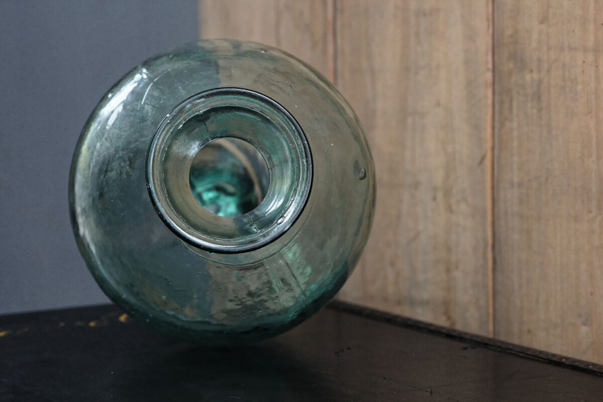 Old blown glass bottle, amphora-shaped