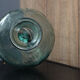 Old blown glass bottle, amphora-shaped
