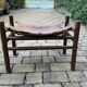 Vintage safari stool in brown leather and dark wood, 1960s, Mid-Century style.