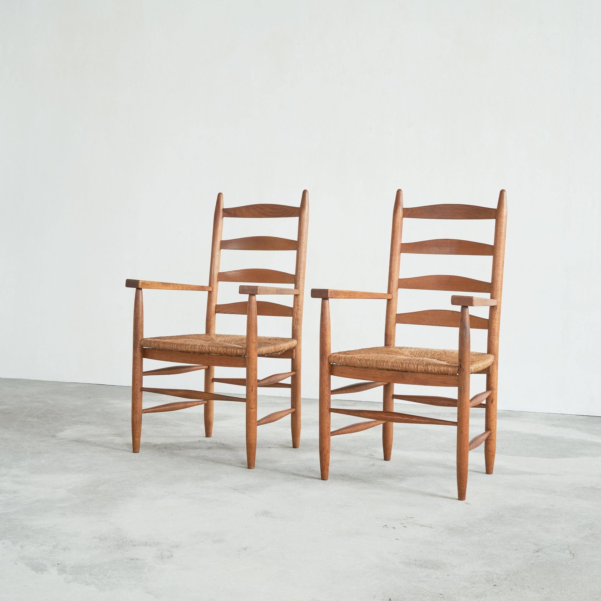 Set of 2 oak and wicker armchairs, mid-20th century.
