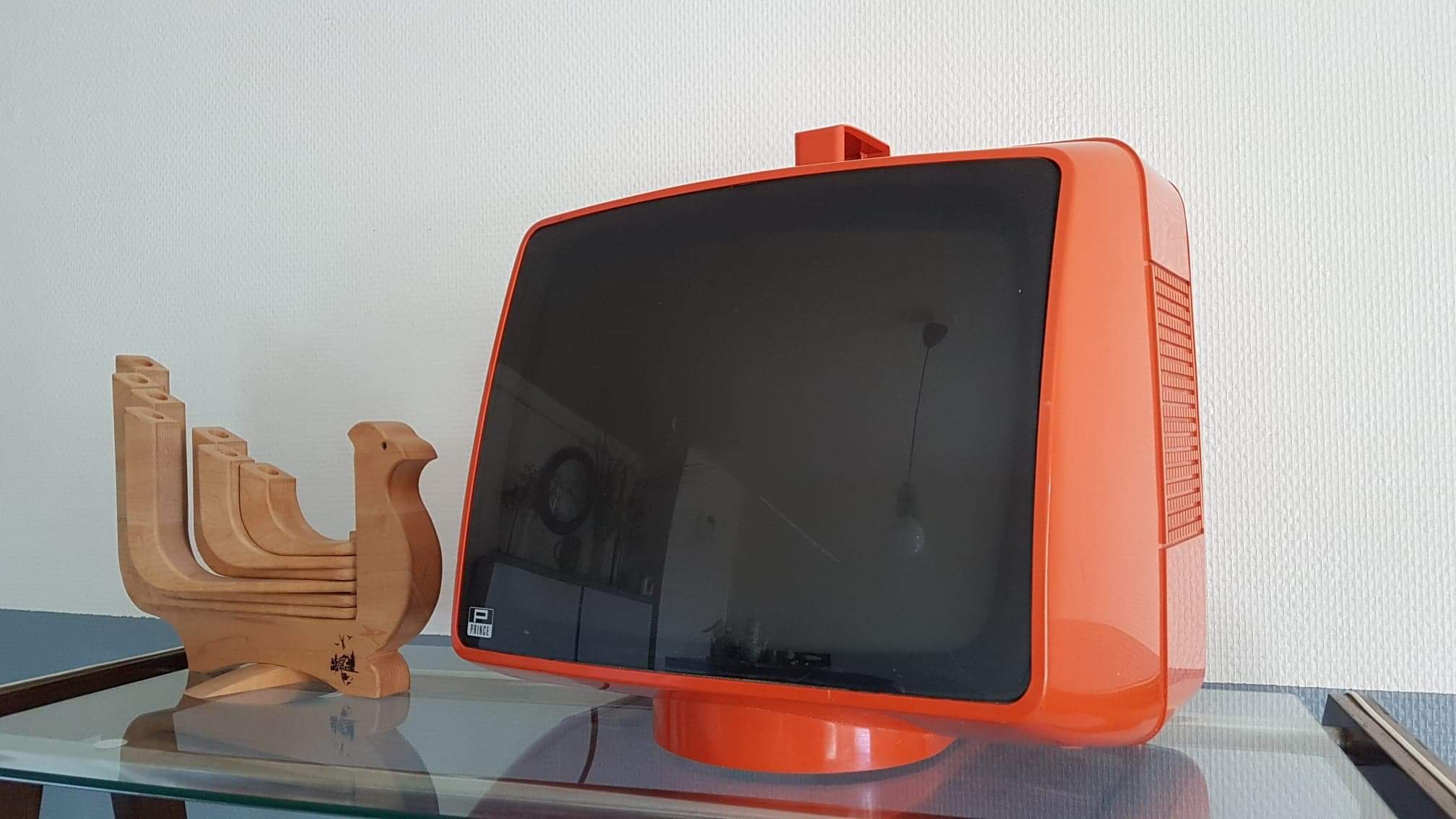 Vintage orange Prince portable TV