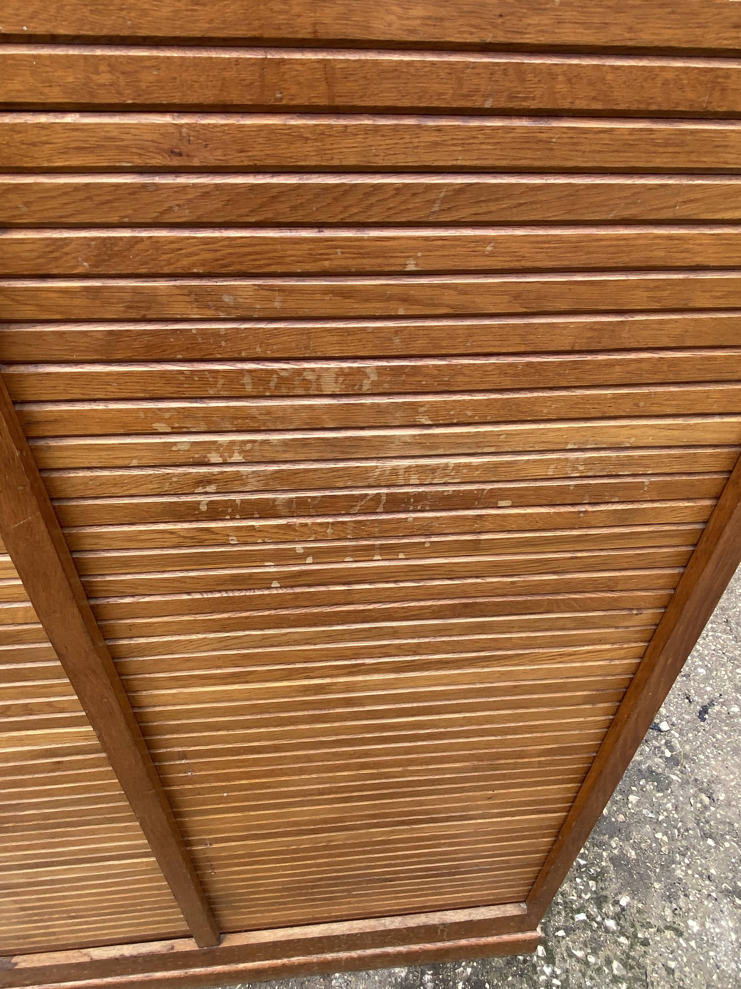 Double-column oak filing cabinet with curtains, 1950s.