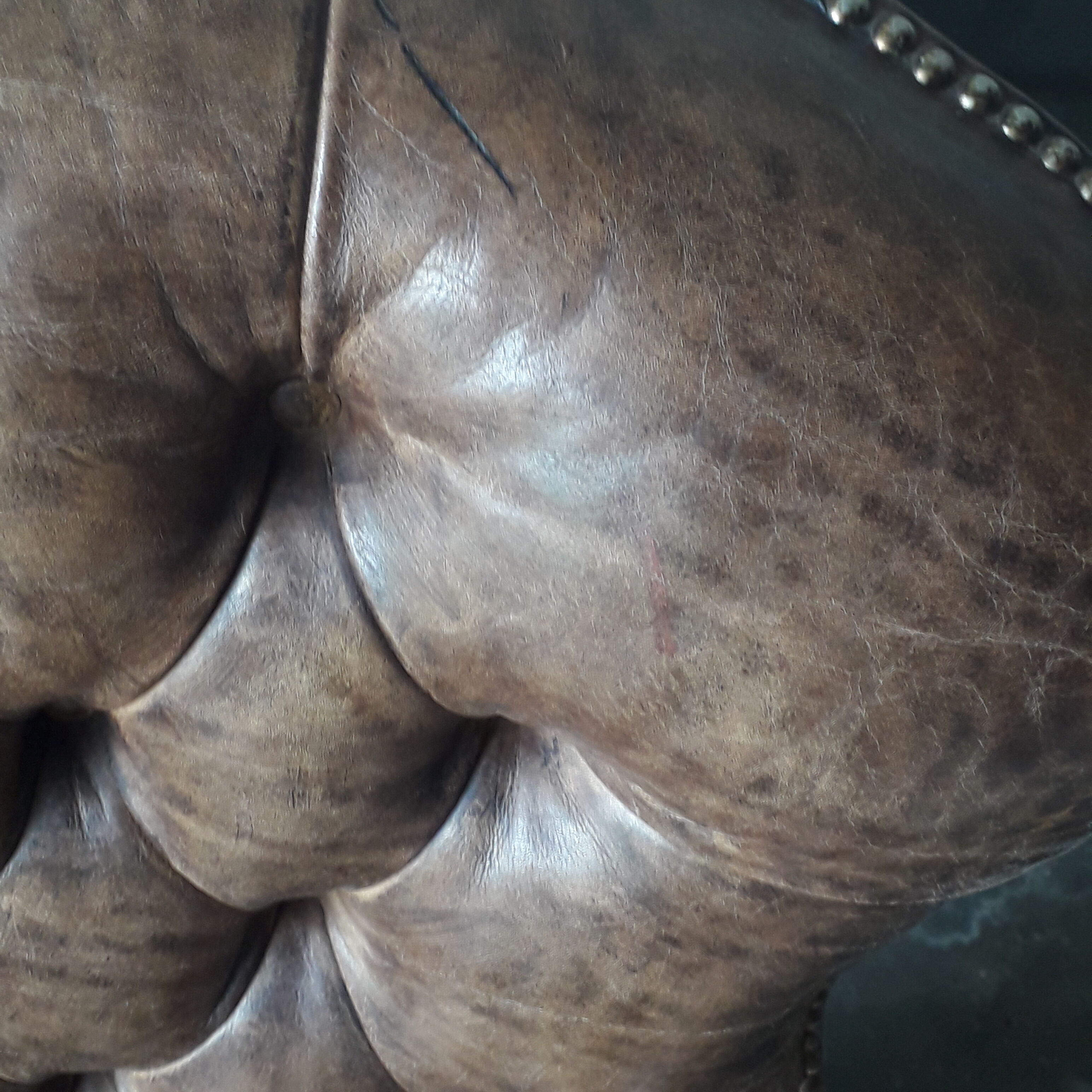 Antique Chesterfield armchair.