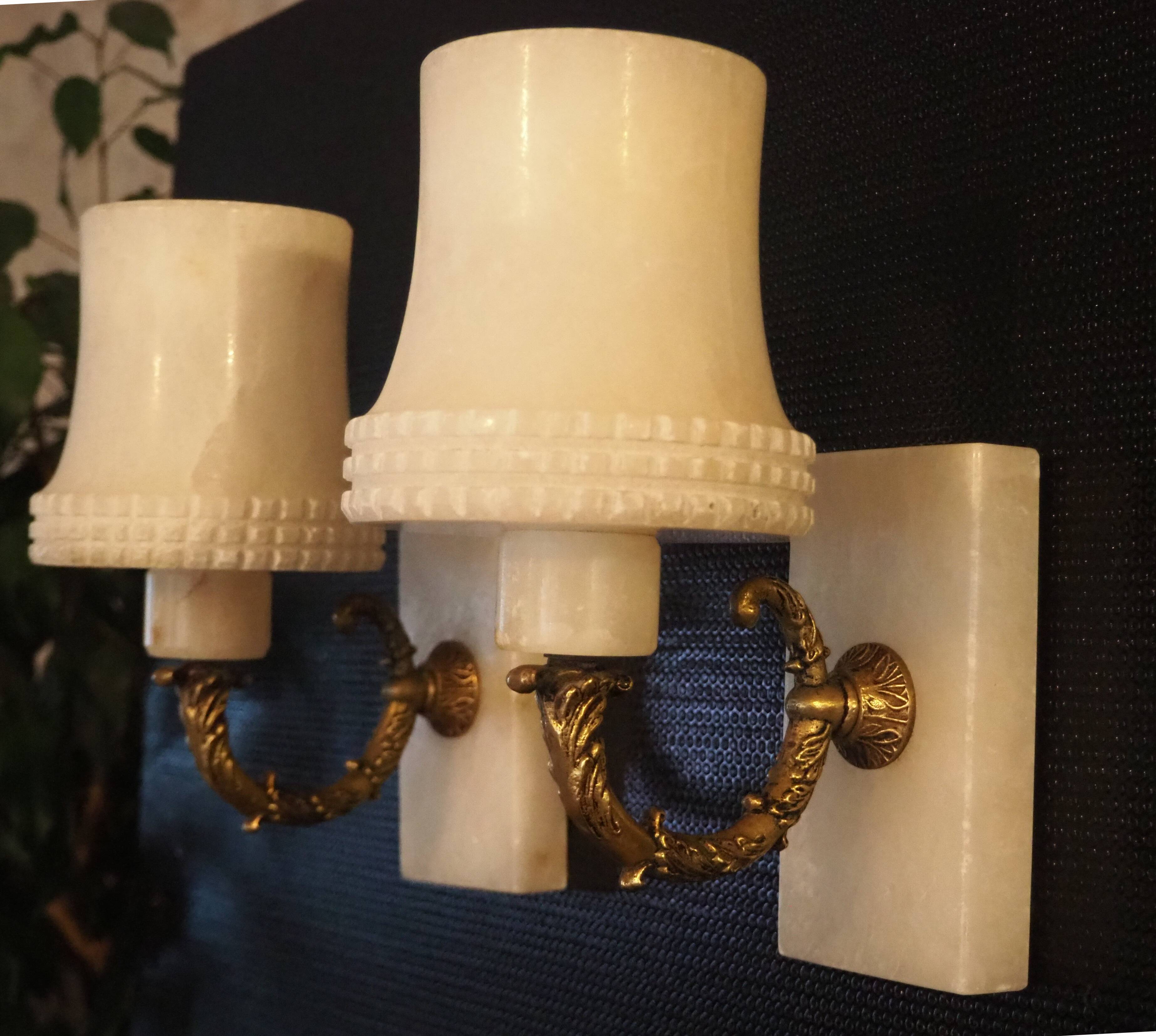 Pair of curved alabaster and bronze appliques