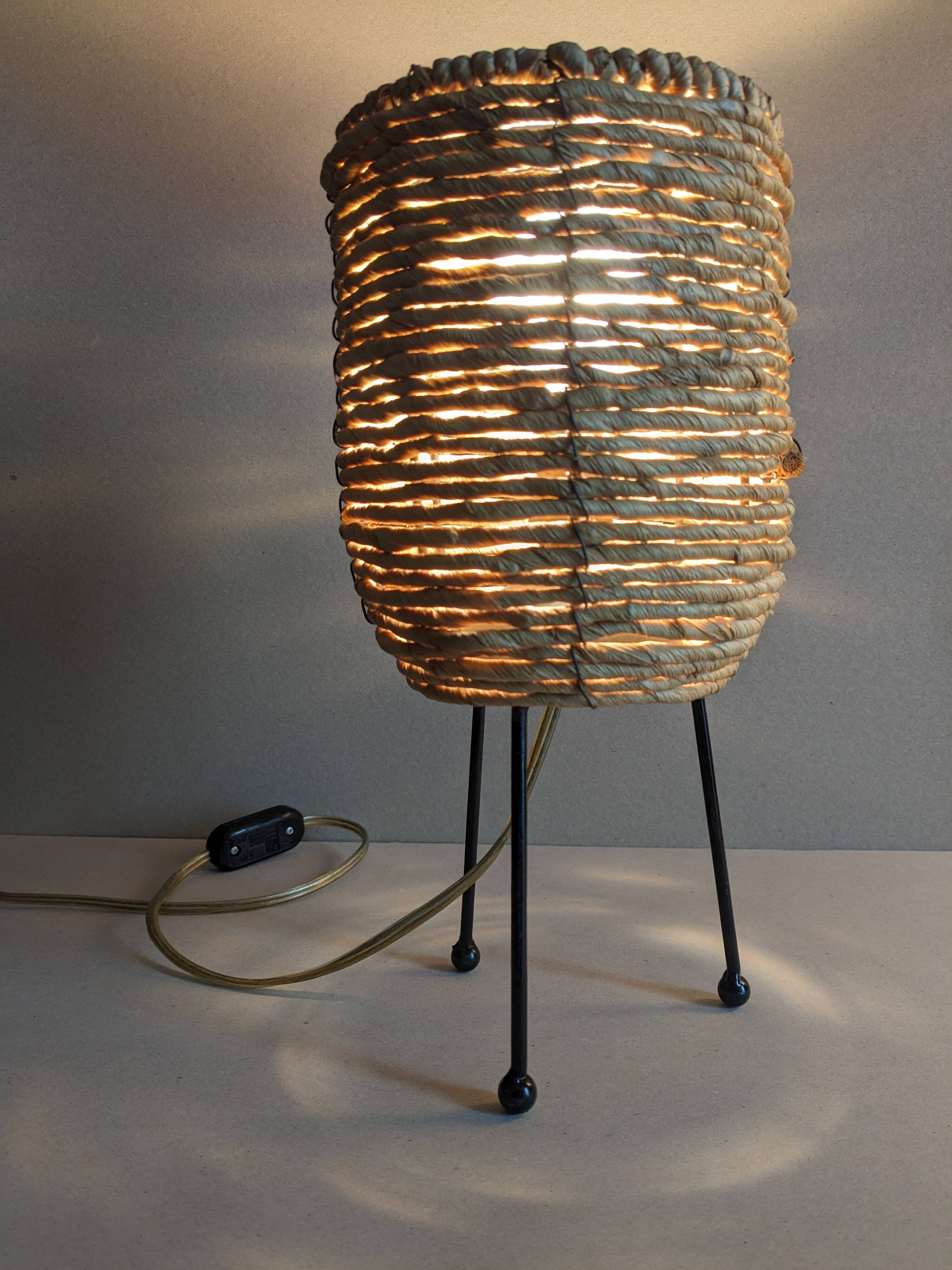 Fiber and metal tripod lamp
