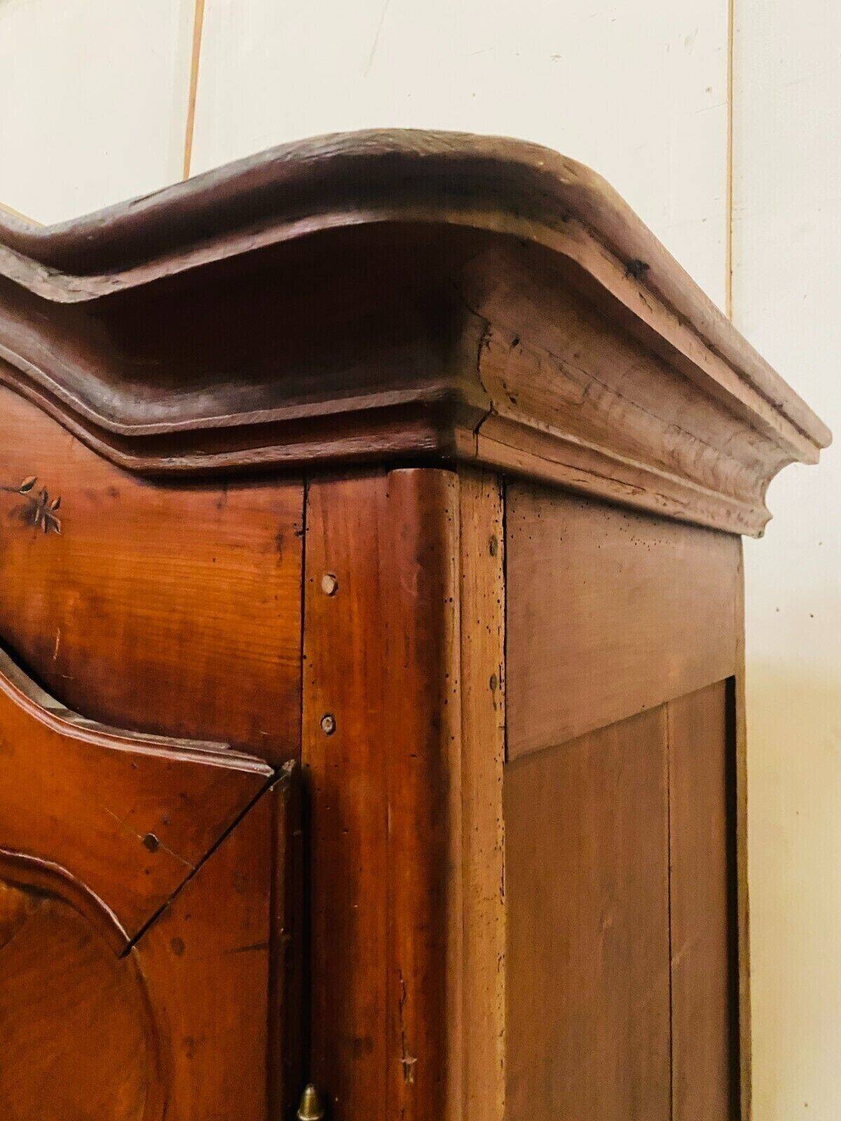 Louis XV armoire with gendarme's hat in solid cherry wood, 18th century