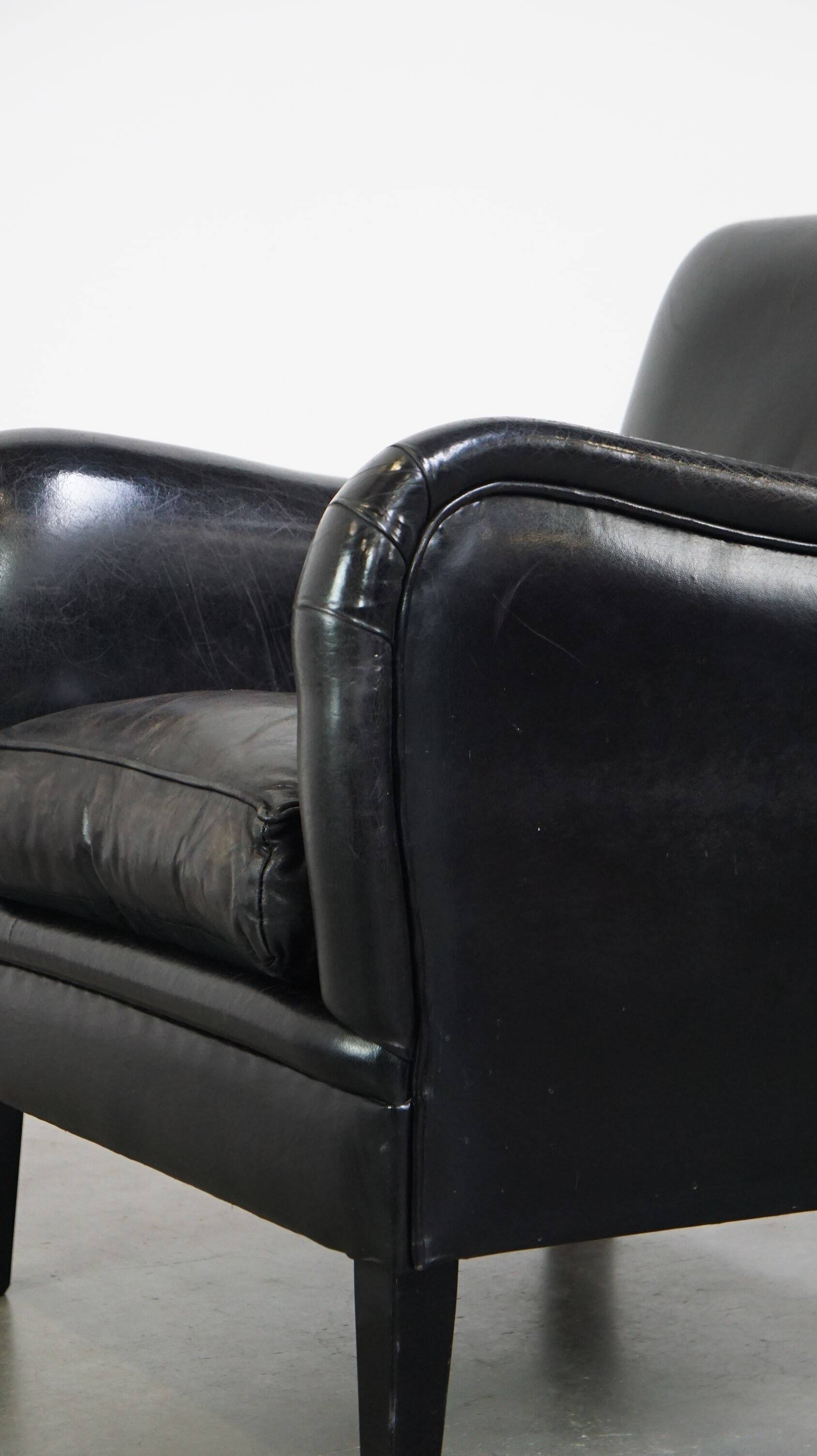 Luxurious and comfortable sheepskin armchair in a unique, stately black color