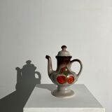 Vintage stoneware teapot with flower and fruit patterns