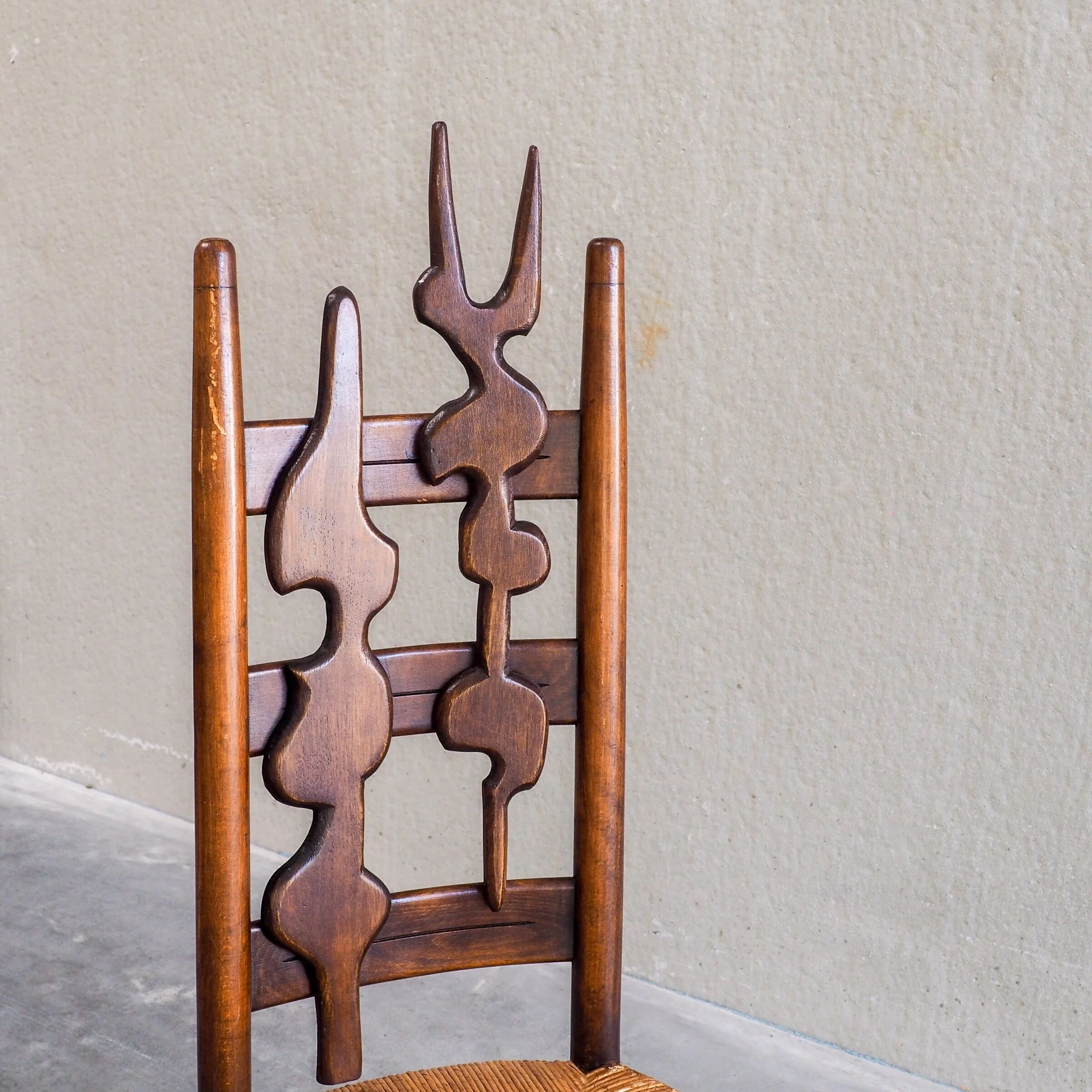 2 sculptural brutalist high-back chairs