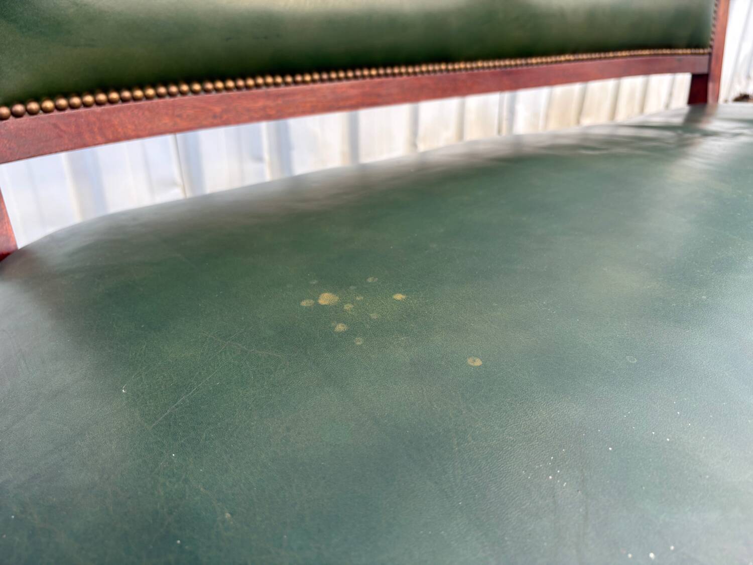 Empire style bench in mahogany and green leather