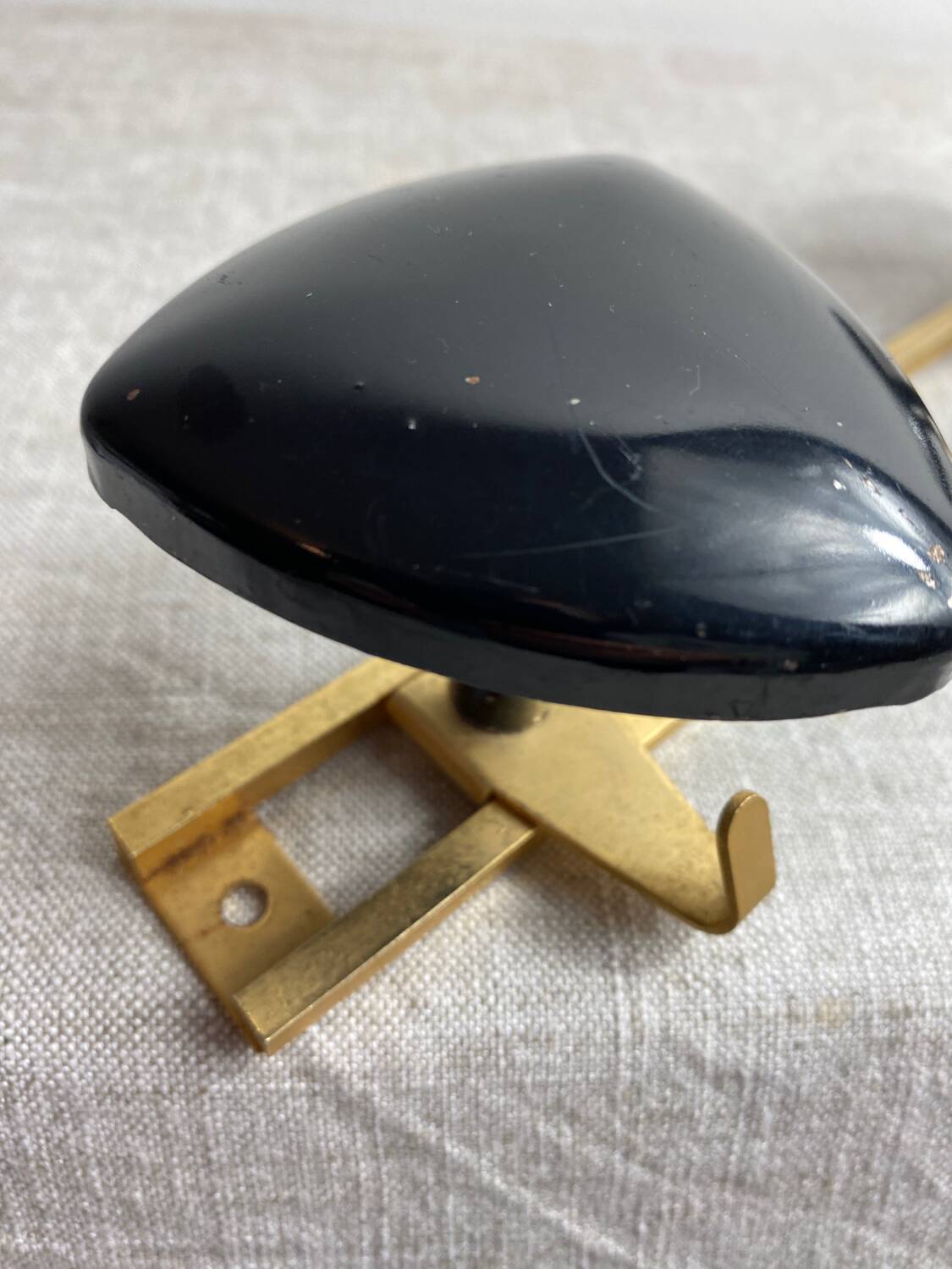 Wall-mounted coat rack with 3 hooks from the 1960s.