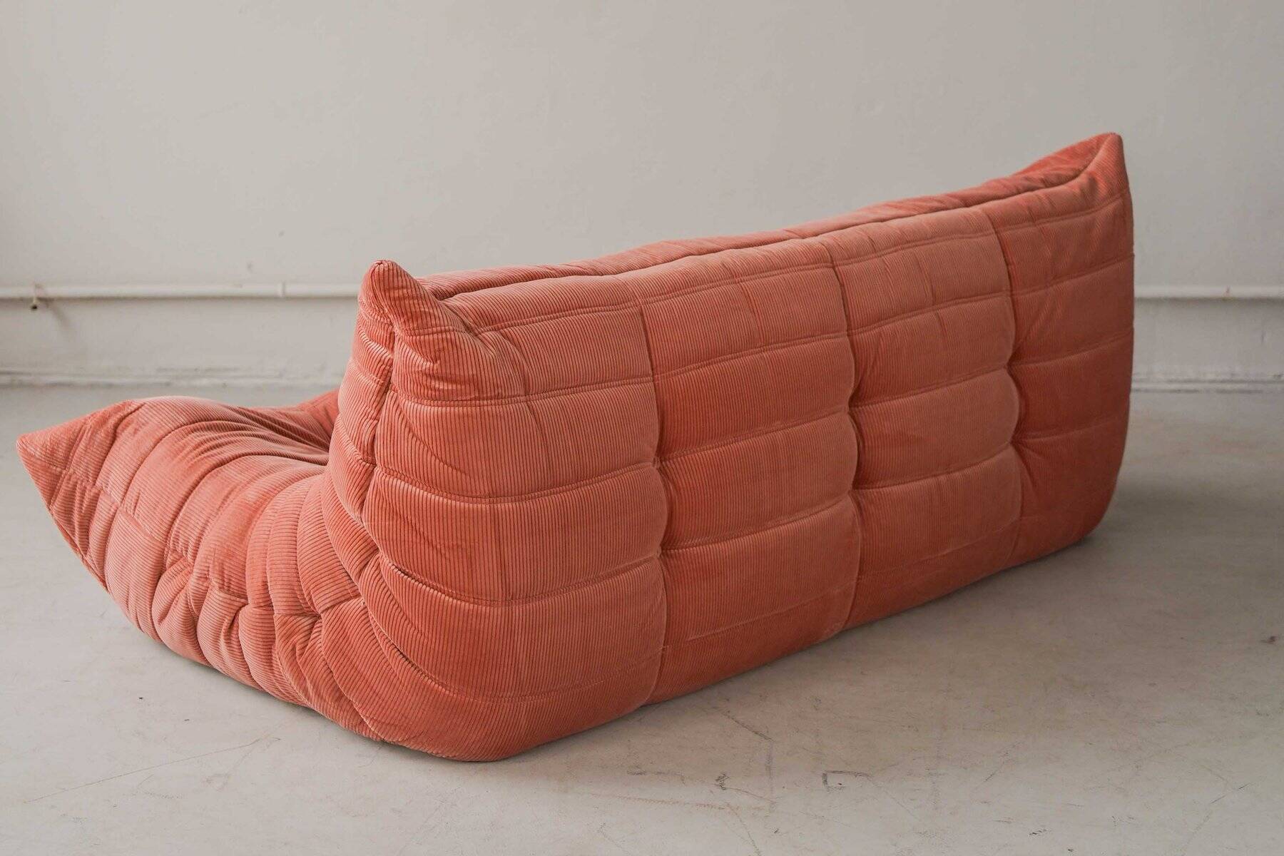 Coral corduroy Togo three-seat sofa by Michel Ducaroy for Ligne Roset