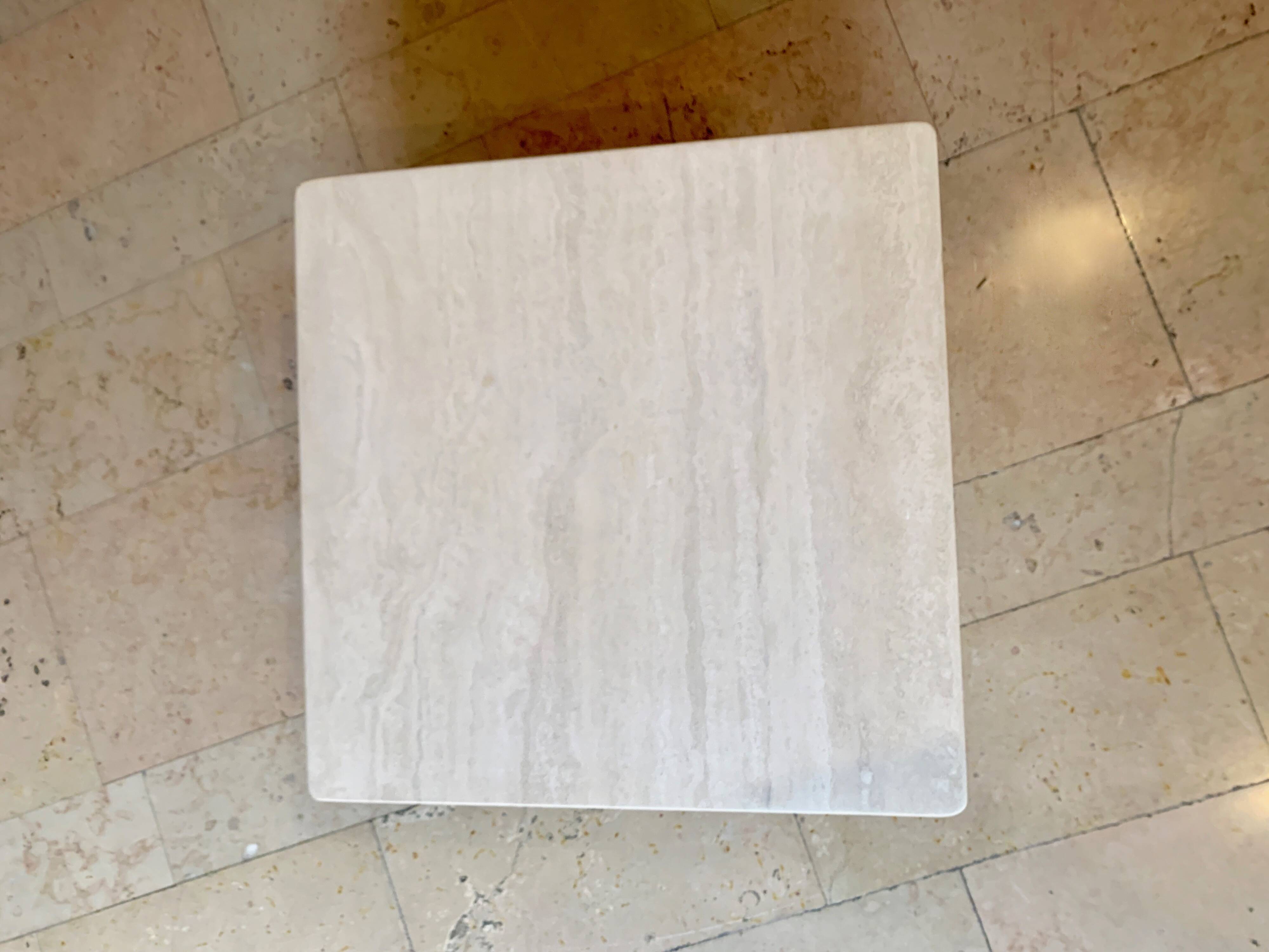 Square coffee table in honed travertine by Claude Berraldacci