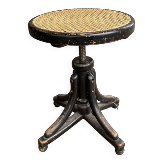 Screw stool with cane seat