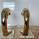 Dolphin bookends in gold metal and plexiglass – 1980s