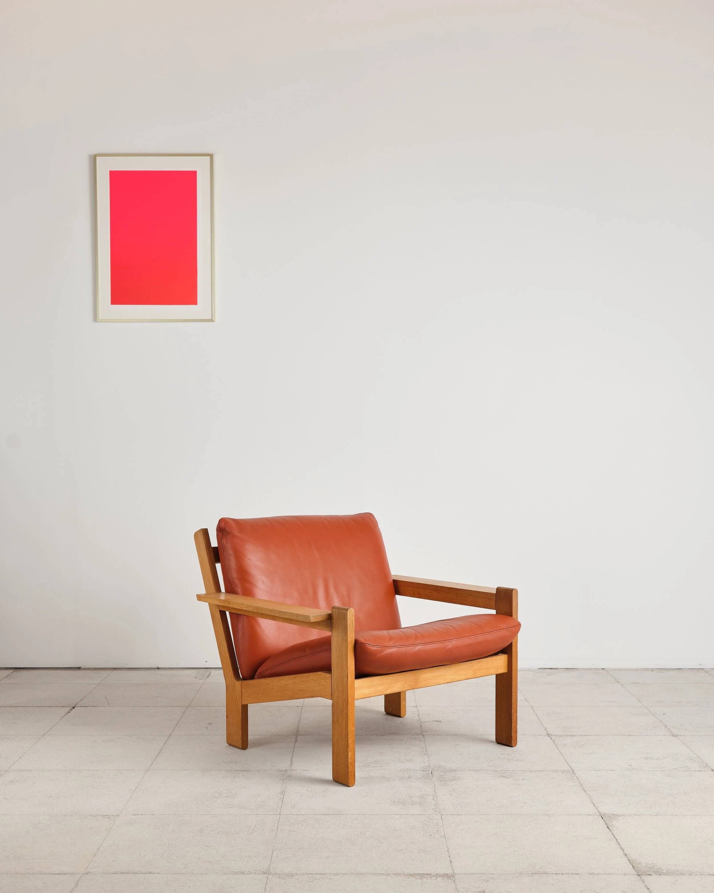 Brutalist armchair in oak and leather by Tage Poulsen, Denmark, 1970s.