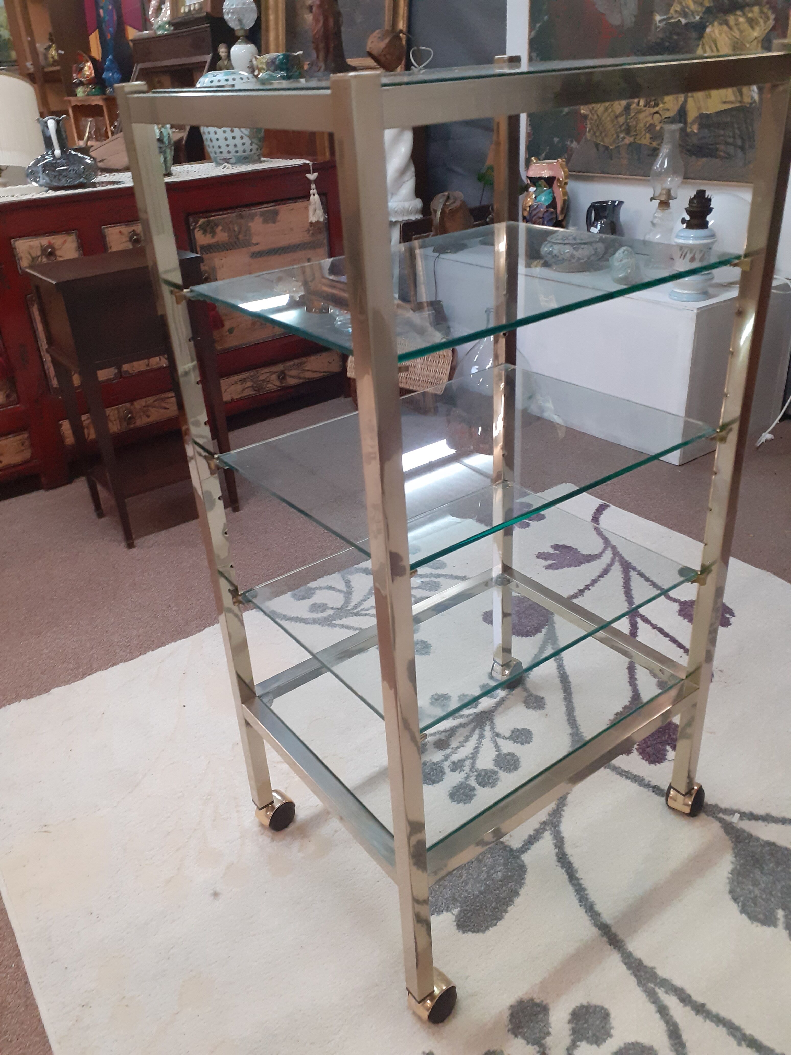 Glass and brass shelf on wheels