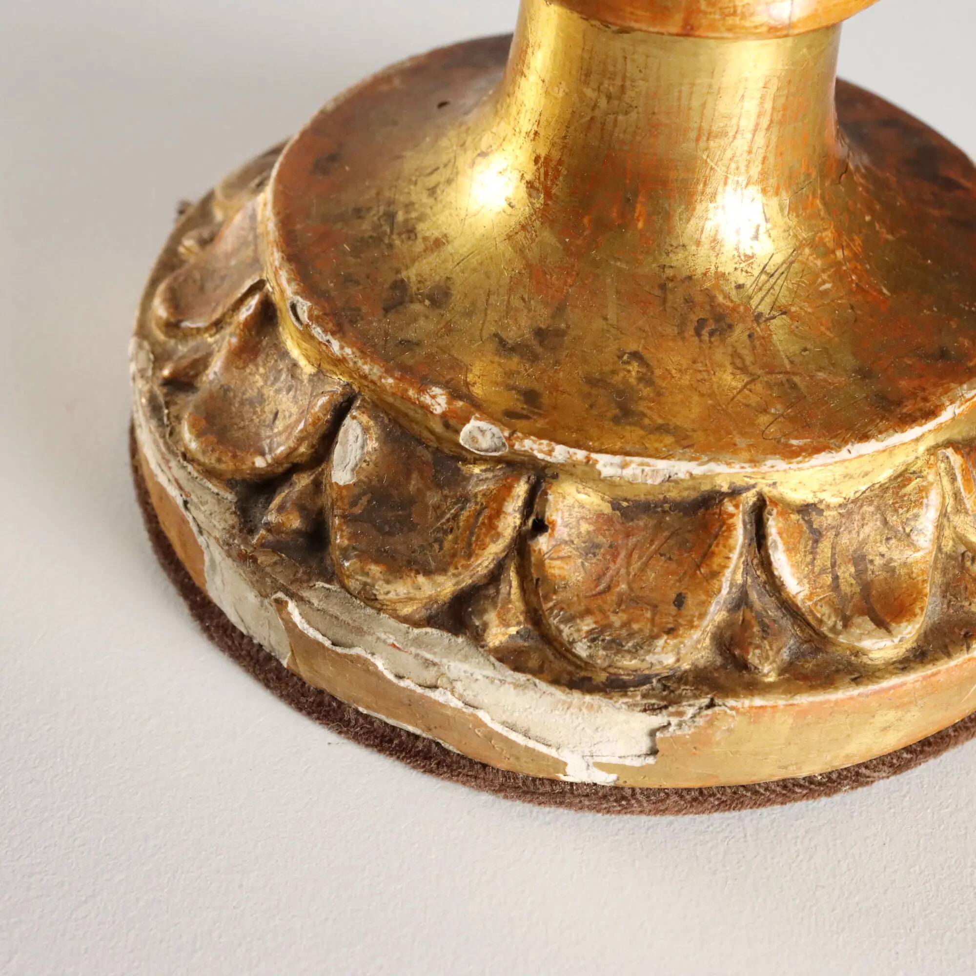 Pair of antique carved and gilded wooden candlesticks, Italy, 19th century.