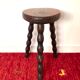 Old tripod stool in solid wood