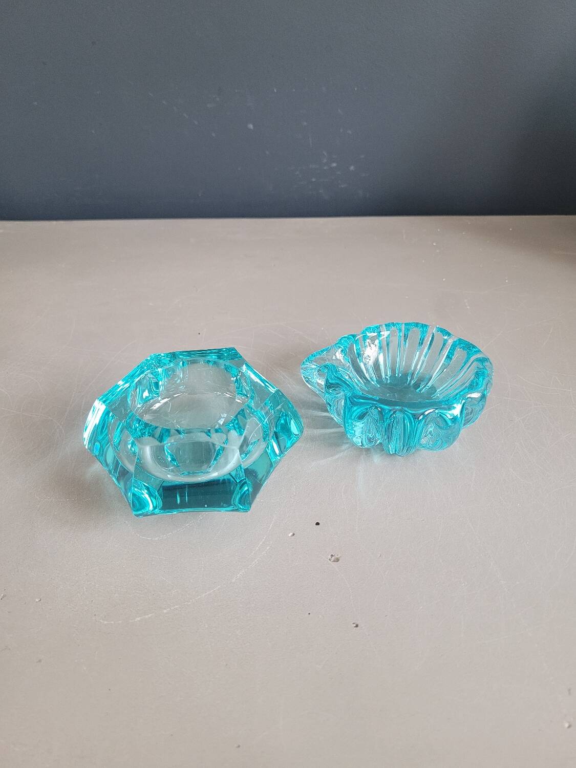 Set of 2 assorted turquoise glass ashtrays