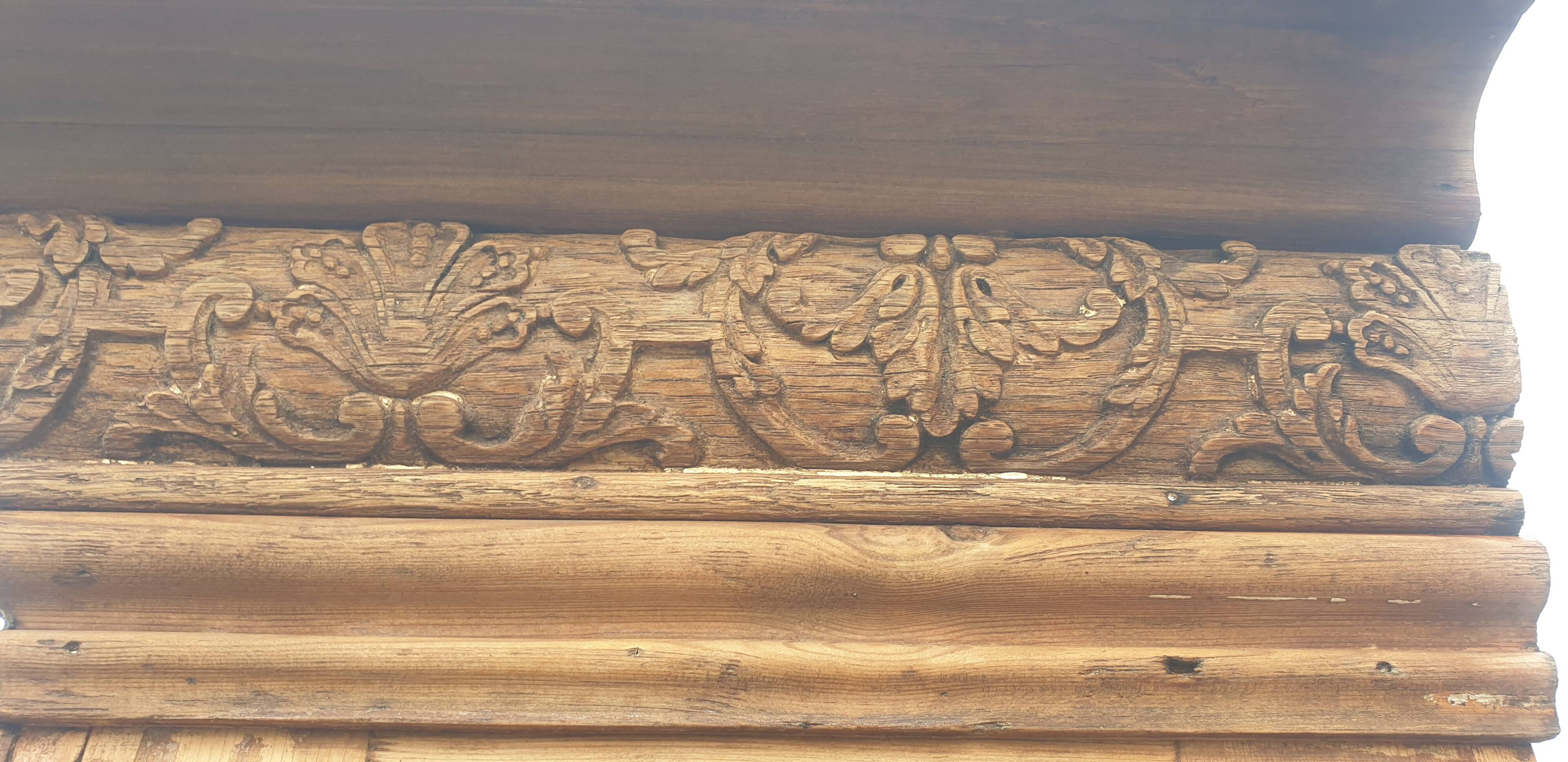 Natural wood bookcase with 3 doors and shelves