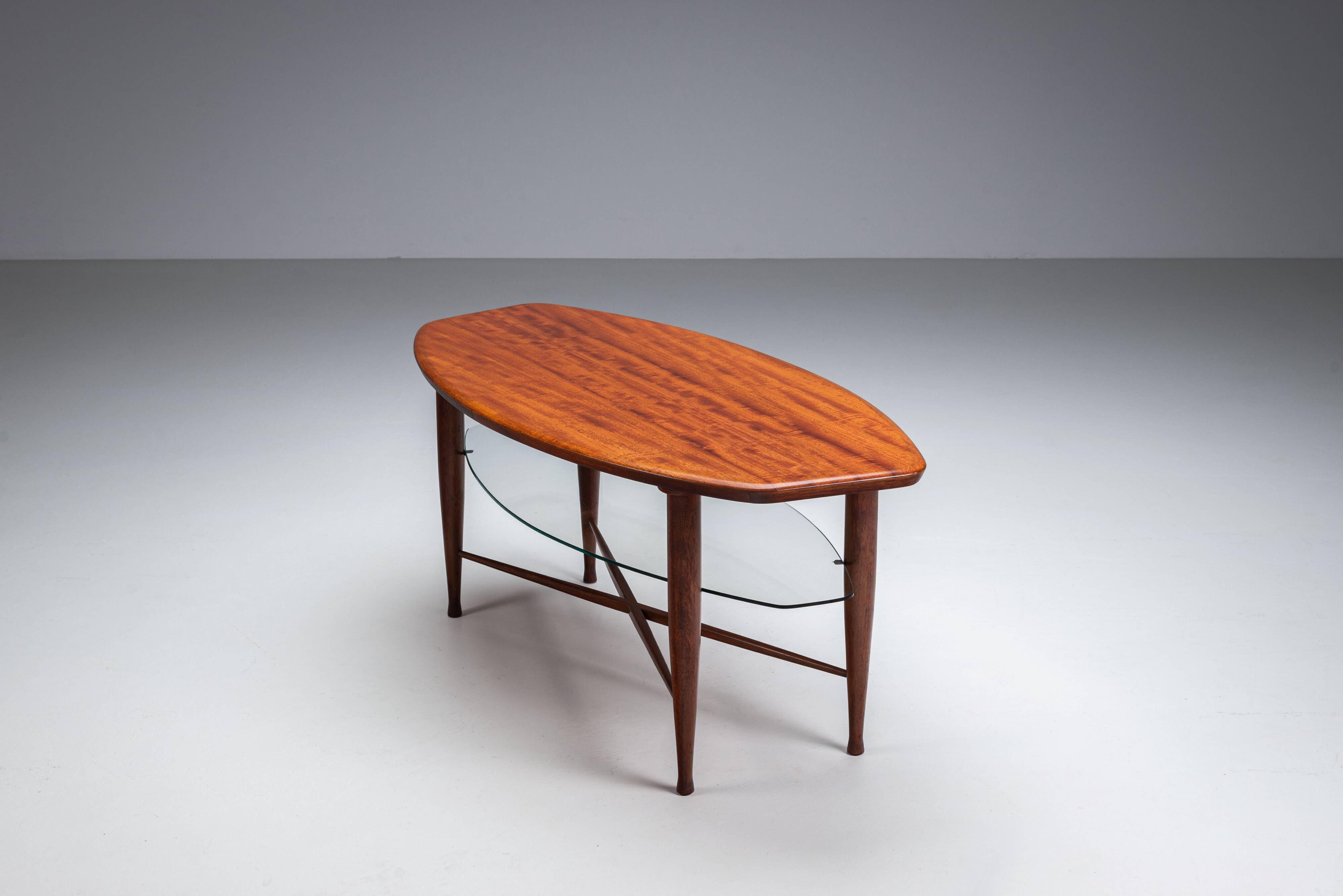 Assymetrical coffeetable with glass storage and cross leg details