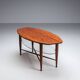 Assymetrical coffeetable with glass storage and cross leg details