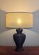 Vintage lamp in brown rattan with textured lampshade.